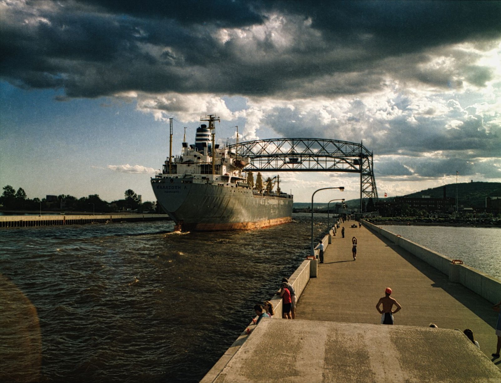 A cargo ship passing under the aerial lift bridge in Duluth Canal, Minnesota.