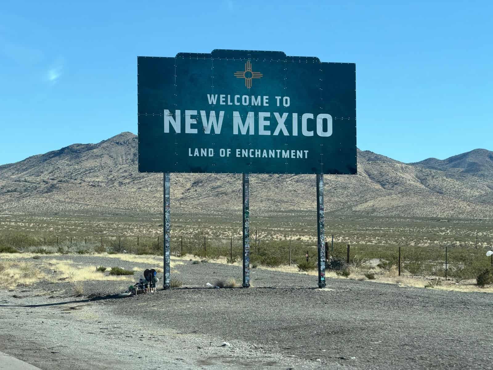 Iconic welcome sign for New Mexico in a desert landscape, tracing the state's enchanting charm.