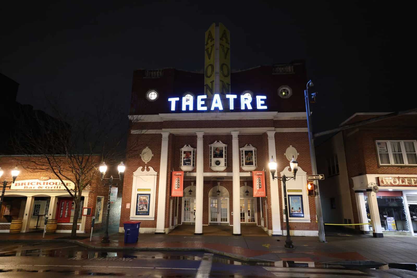 Nighttime view of the iconic Avon Theatre in Stamford, Connecticut, beautifully illuminated.