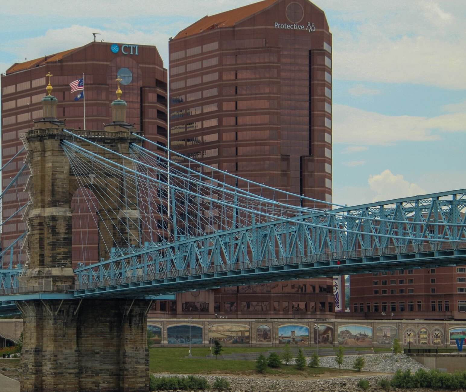 View of the iconic John A. Roebling Suspension Bridge with Cincinnati skyline in the background.