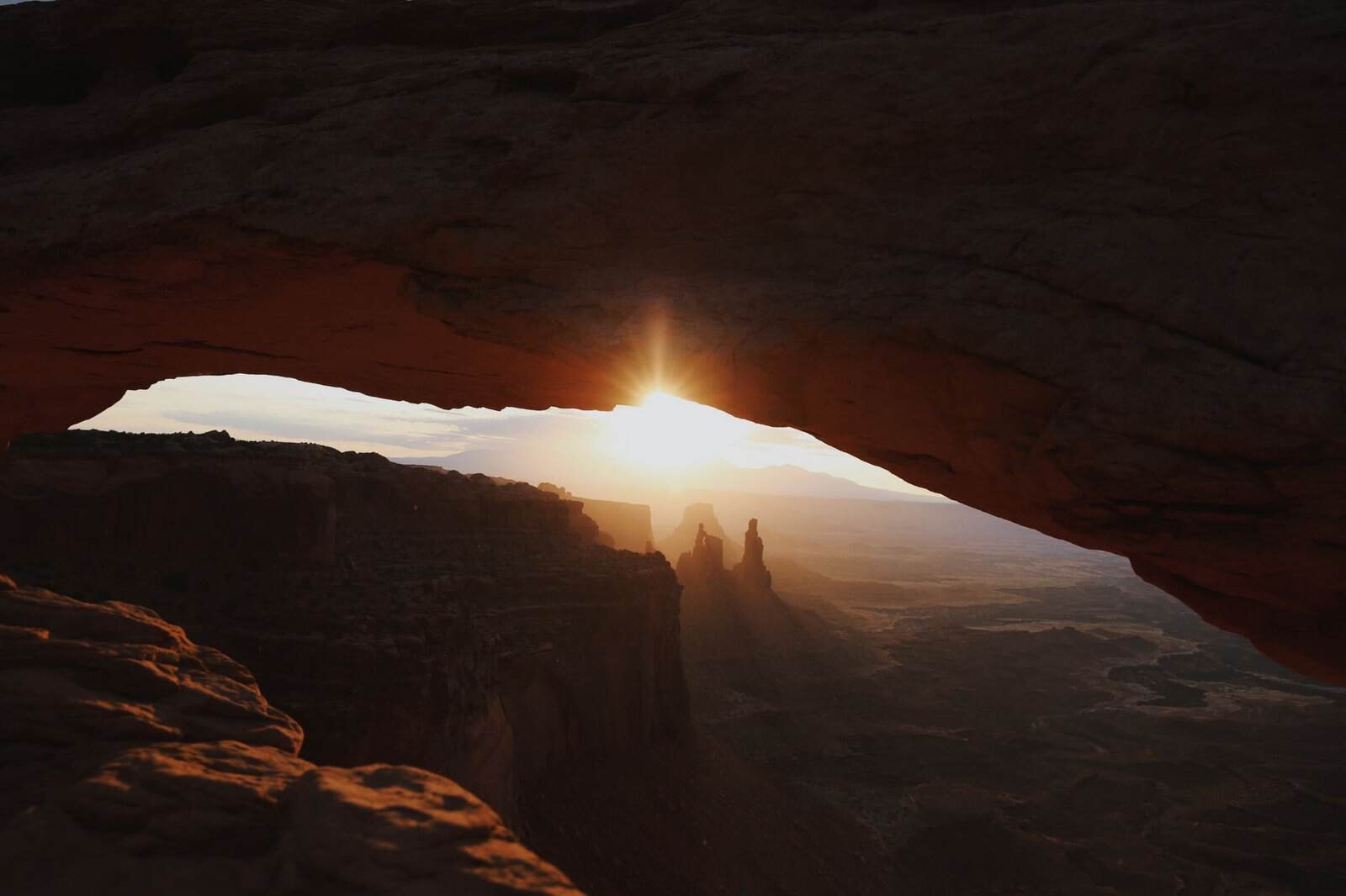 Stunning sunrise view through Mesa Arch in Canyonlands National Park, Utah.