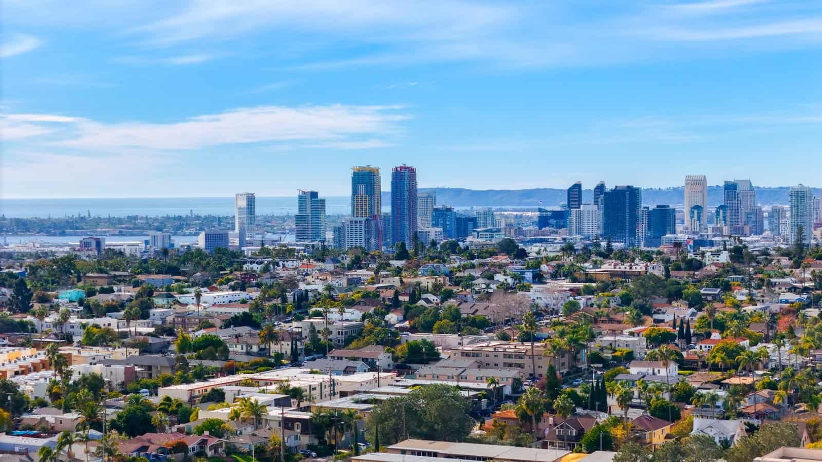 Stunning aerial cityscape of downtown San Diego featuring urban skyline and suburban sprawl.