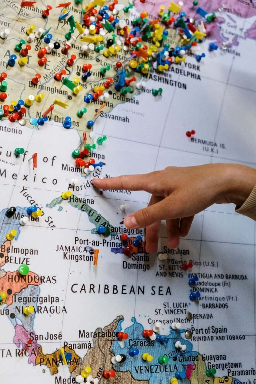 A traveler navigating a local market and interacting with vendors abroad