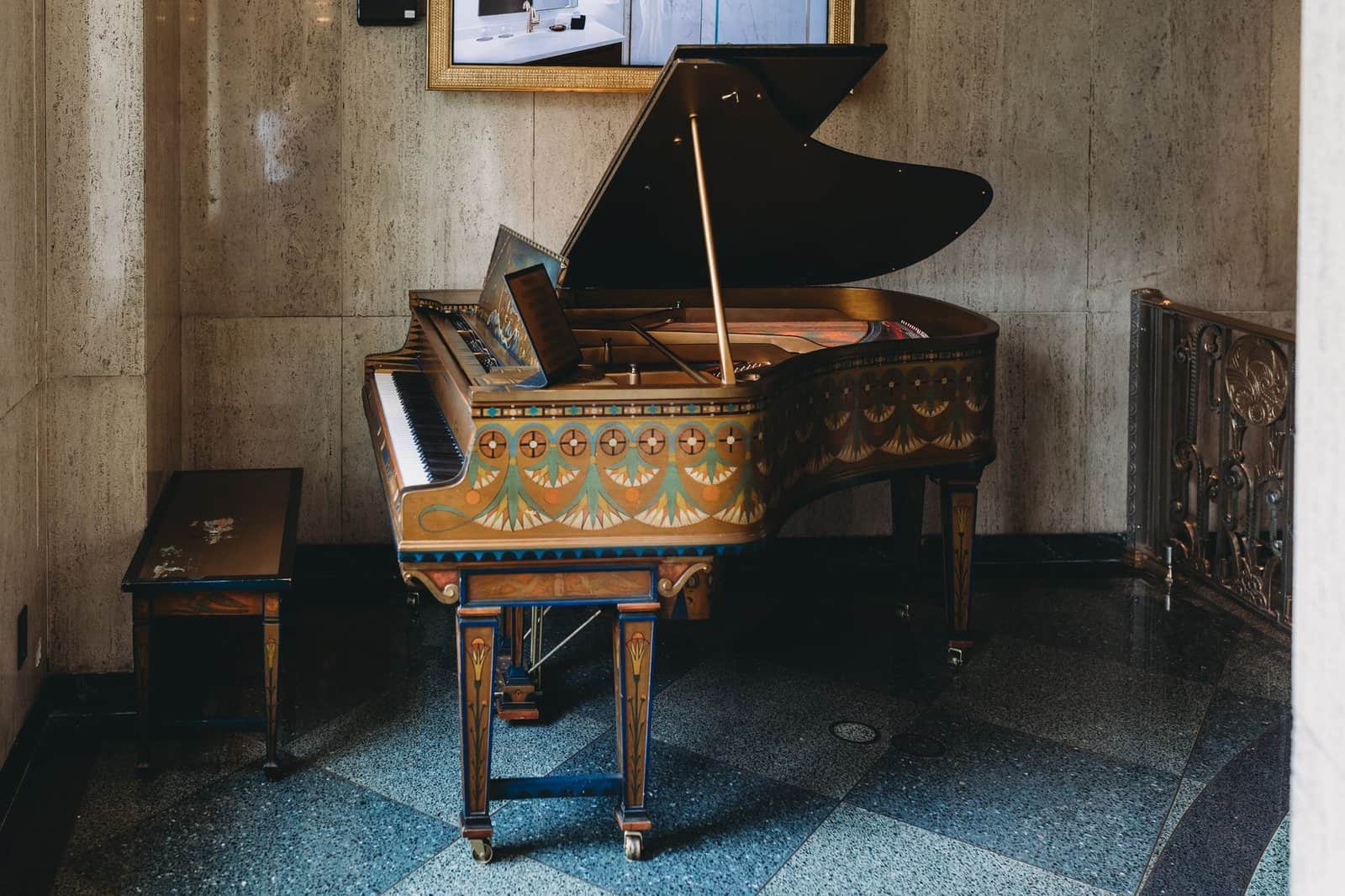 Ornate vintage piano with intricate design in an elegant indoor setting, Indianapolis.