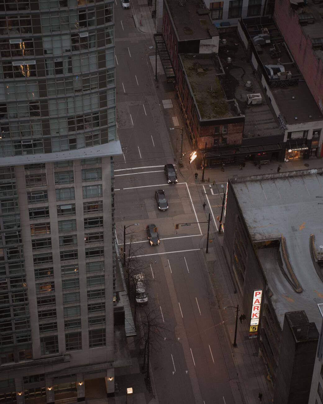 High-angle cityscape view of downtown Vancouver street in the late afternoon.
