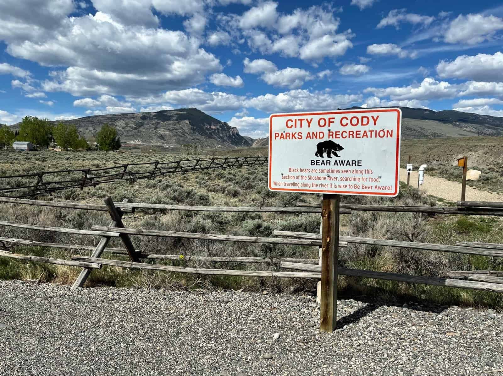 Explore City of Cody's natural landscape with bear awareness signage.