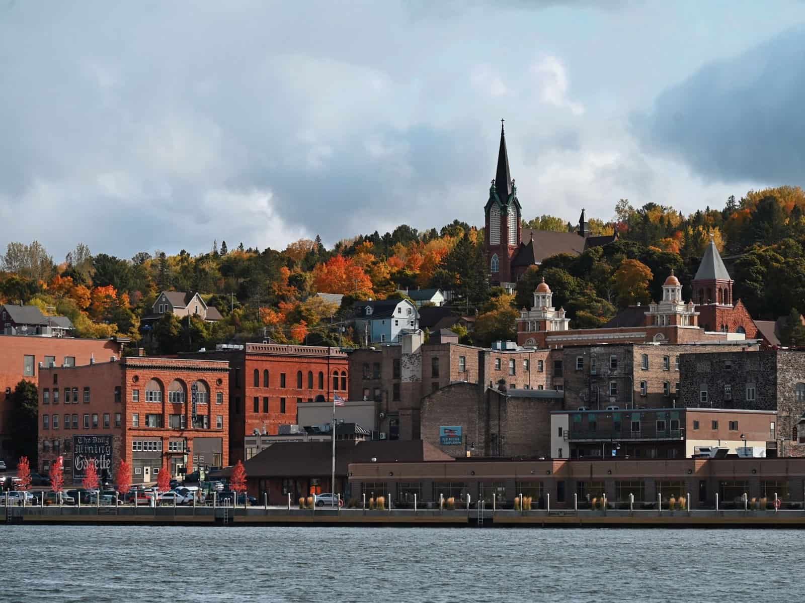 Charming downtown Duluth with fall foliage and historic buildings along the lakeshore.