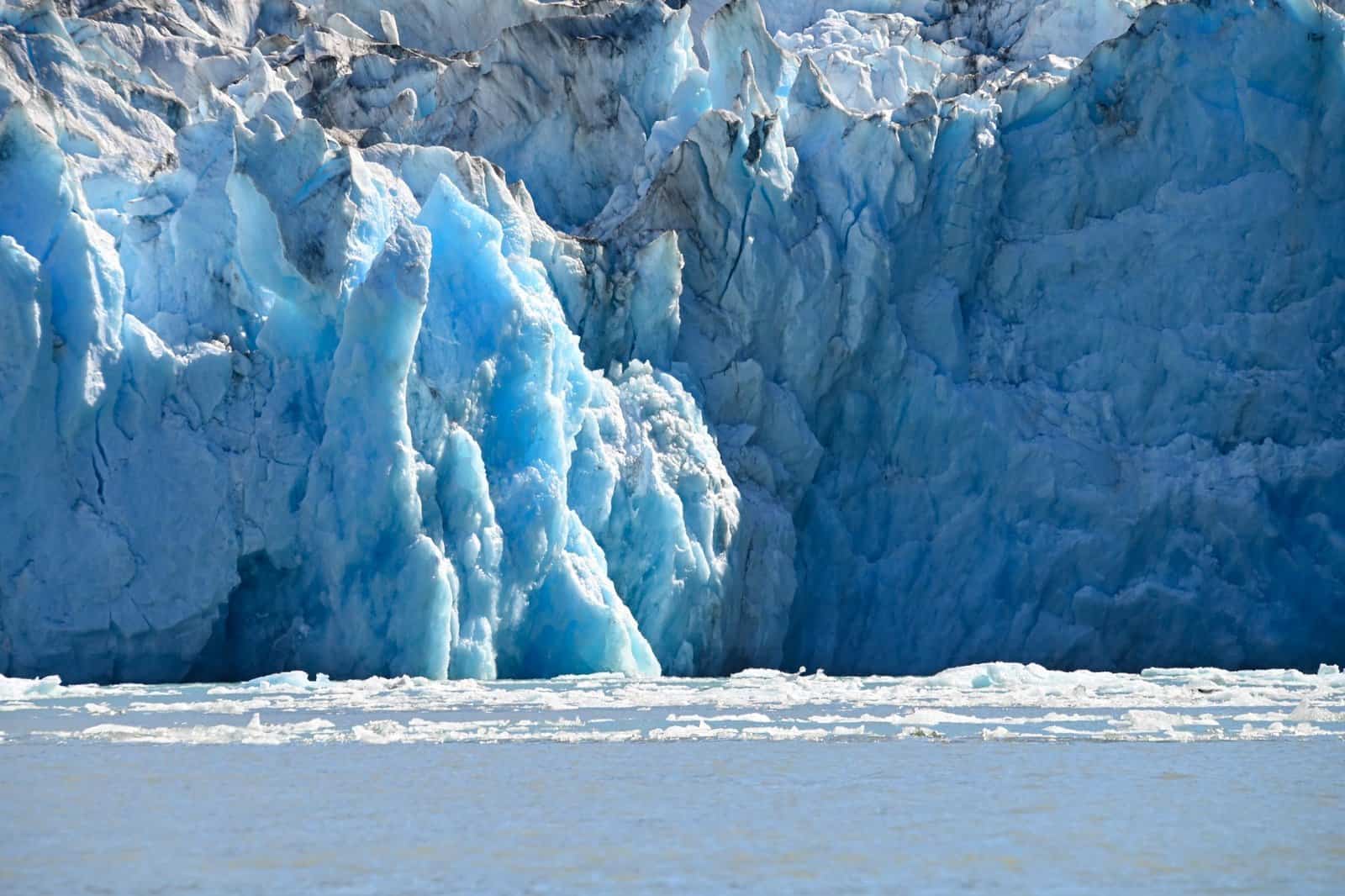 Stunning view of blue ice formations at Dawes Glacier in Endicott Arm, Alaska.