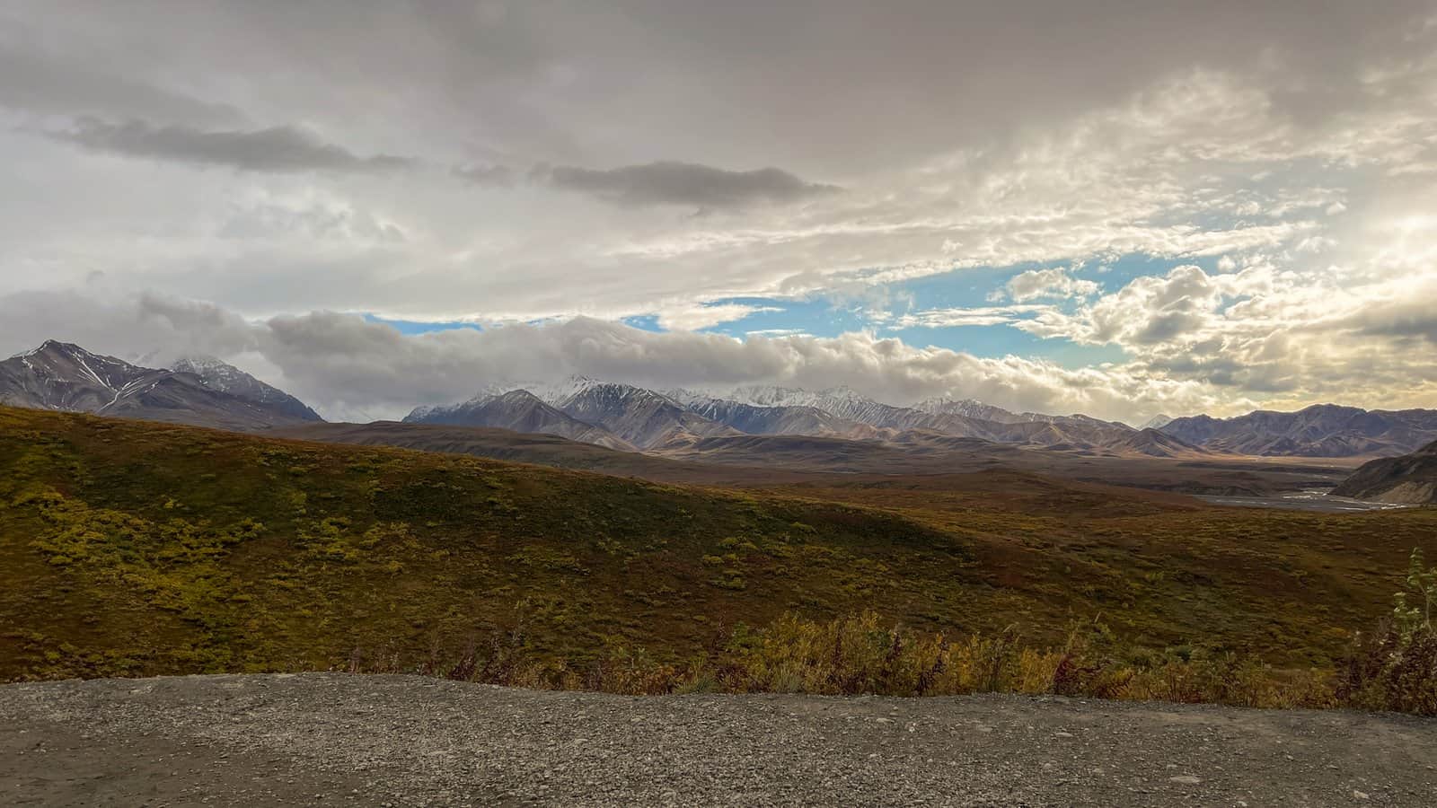 Breathtaking view of Denali National Park's rugged mountains and vast valleys in fall.
