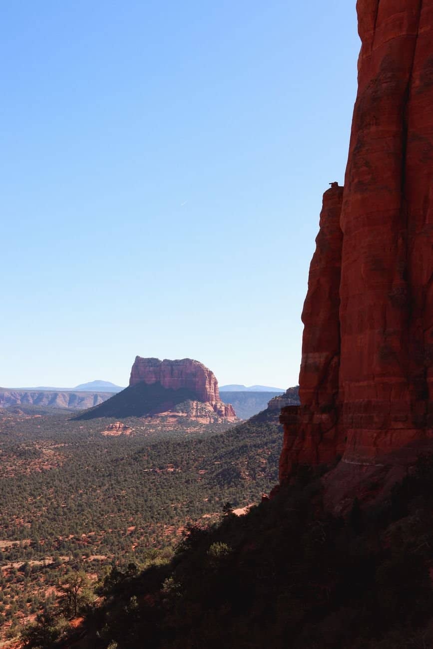Stunning vertical shot of Cathedral Rock against a clear blue sky in Sedona, AZ.